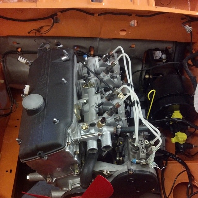 Engine and transmission installed in the Colorado Orange 72 Tii this morning!!! #bmw #bmw2002 #2002tii #tii #bmwclassic #bmwrestoration #bimmer #bimmergram #bmwgram #alpina #rare #engine #installed #cars #carporn #sportscarrestoration #thecarlife